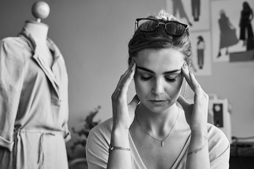 Frustrated woman, fashion designer and stress, anxiety in depression, fatigue 