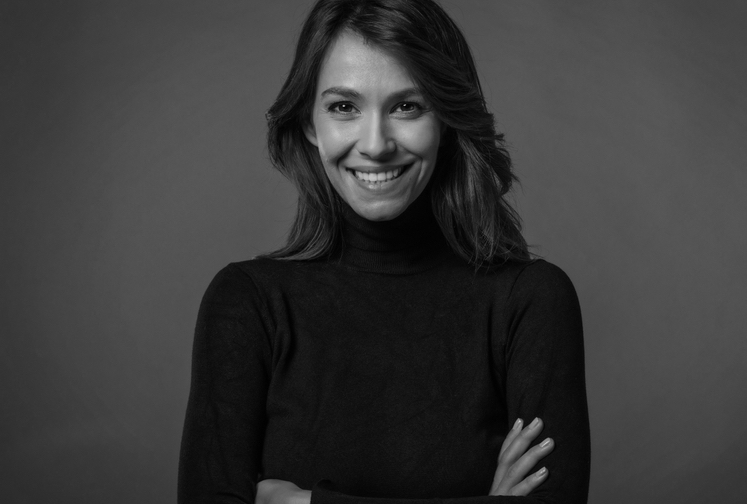 Close-up of an attractive middle aged woman with toothy smiling, confident. 