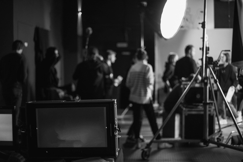 Actors, film set, crew, lighting devices, filming equipment and a team of specialists in filming movies, advertising and TV series
