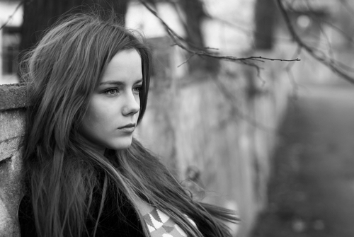 girl staring into distance black and white photo