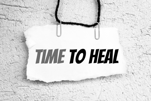 time to heal text write on paper