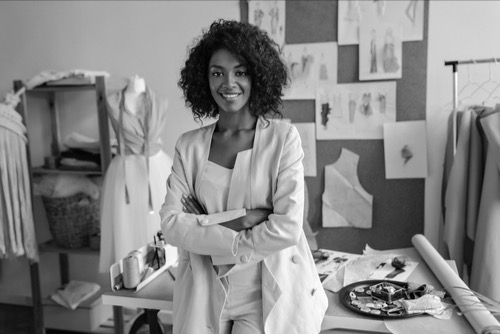 Entrepreneurial, fashion designer woman happy