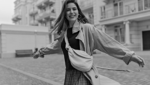 Female, happy in the city, image of confidence and emotional freedom.